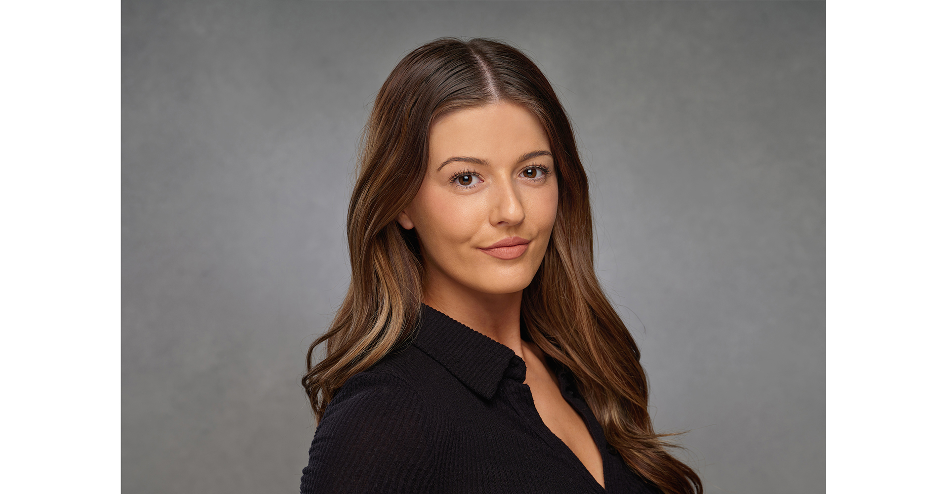 Actress Long brown hair headshots front of a canvas painted grey backdrop